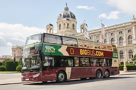 Red electric hop-on hop-off double-decker bus by Big Bus Tours in front of the Natural History Museum Vienna