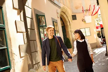 Couple in love goes for a walk in Vienna's Old City