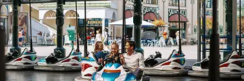 Family riding the autodrome in the Prater