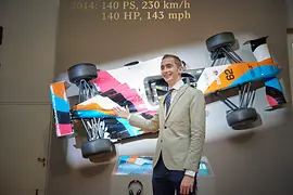 Ferdinand Habsburg with his race car in the Imperial Carriage Museum Vienna