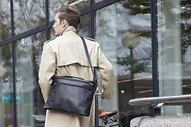 Man with leather bag by Eva Blut