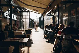 Neni at Naschmarkt, interior shot with guests and a view out of the window 