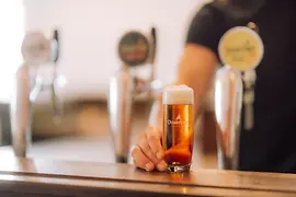 Ottakringer beer in a glass at the bar