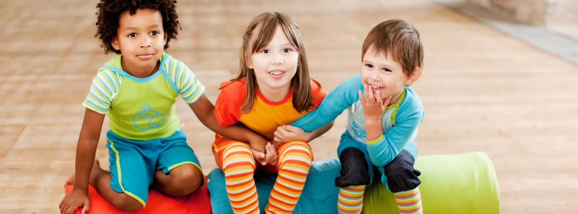 Three children in colorful clothing