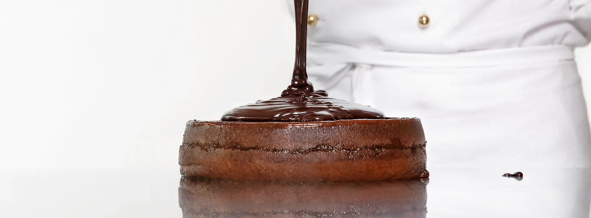 Sachertorte getting its chocolate glaze