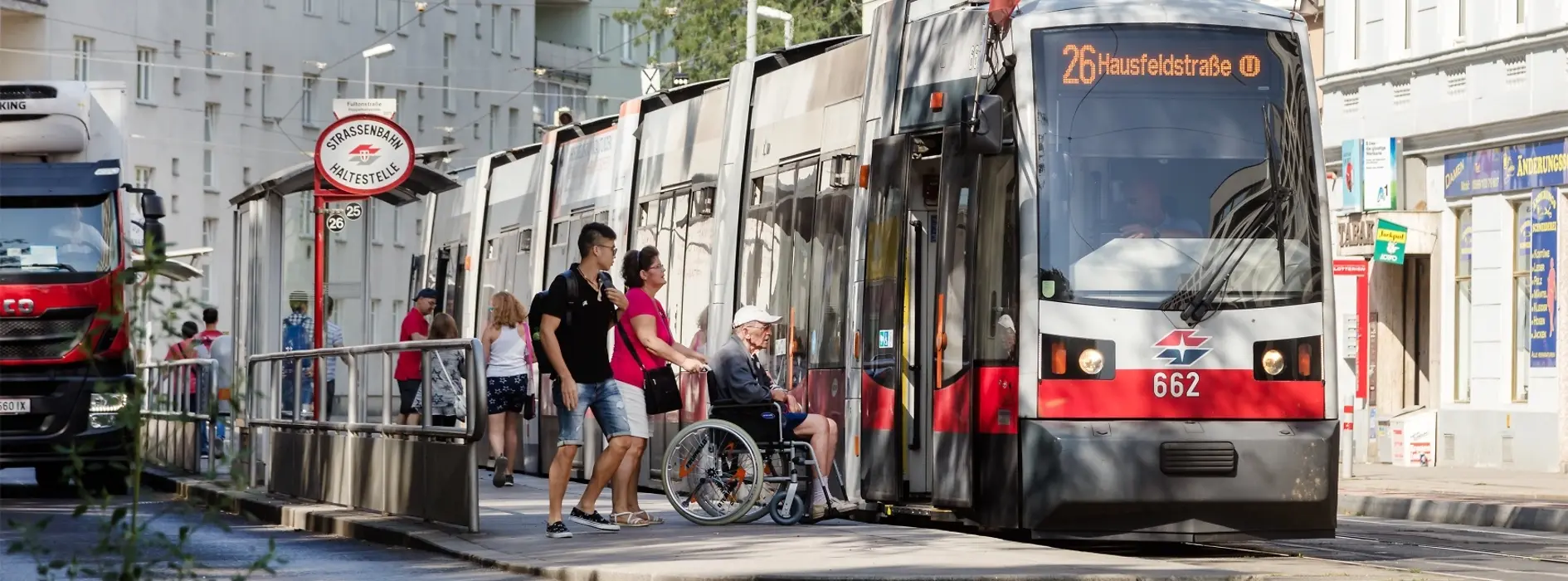 Wheelchair user next to low-floor streetcar