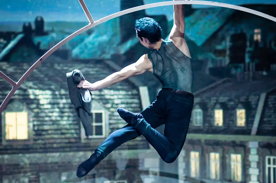 A dancer suspended in mid-air during a scene from the ballet “Peter Pan”