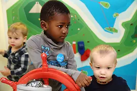 ZOOM Ocean: three children near the boat wheel