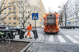 Waste management: Trash collection and employess with garbage cans