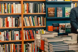 Shelves and tables with books in the LGBT bookstore Löwenherz