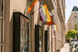 Entrance to the LGBT book store Löwenherz with rainbow flag