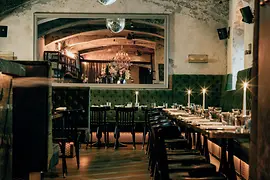 Motto restaurant with glitterballs and tables with candles