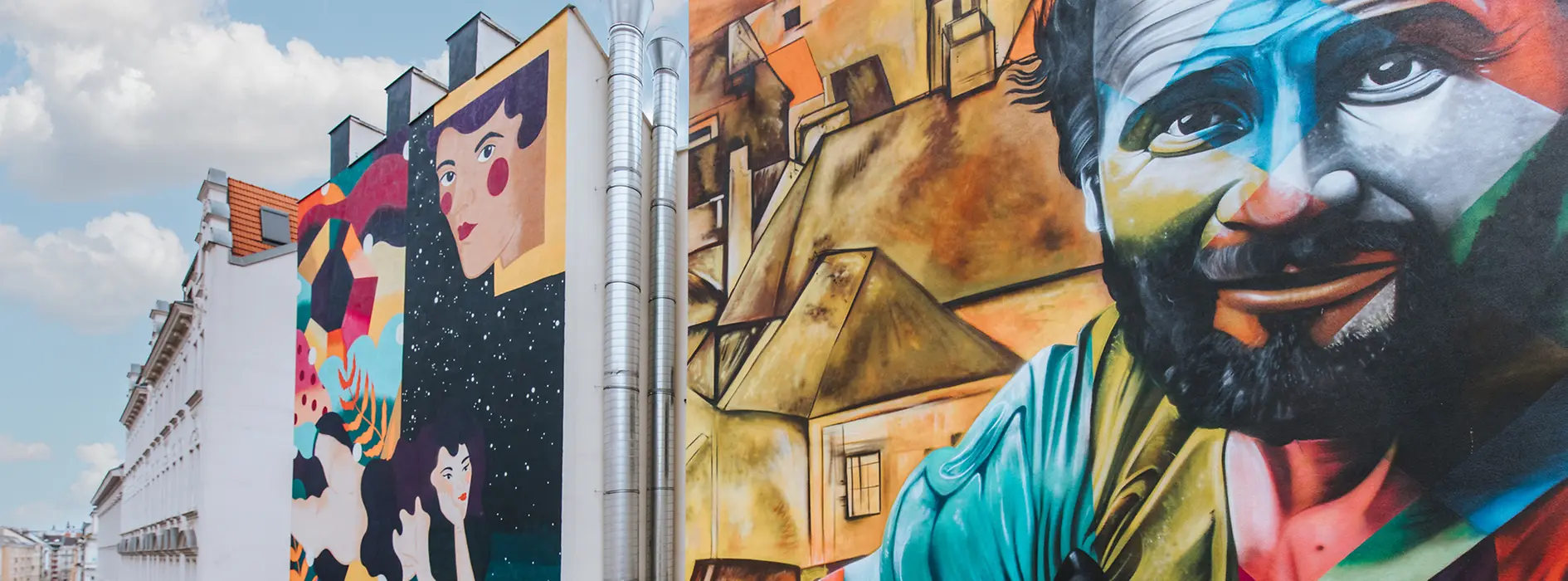 Wall paintings at Wiedner Hauptstrasse 78: Kruella d'Enfer interprets Schiele's "Female Nude Lying on her Stomach" and the Brazilian artist Kobra's "Klimt with Cat"