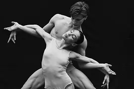 Two dancers in an expressive pose from the ballet production “American Signatures”