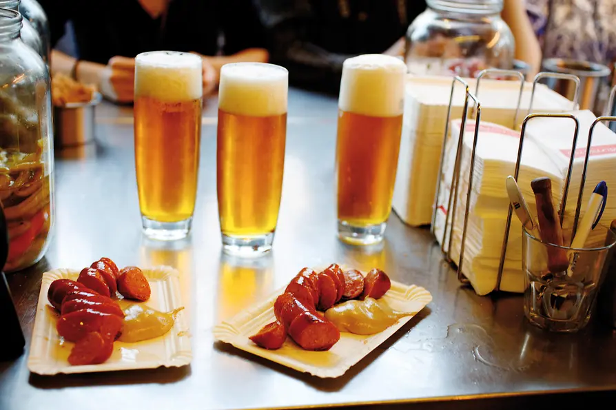 Käsekrainer and beer at a sausage stand