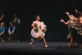 Dance scene from the musical "West Side Story" with actresses performing on stage